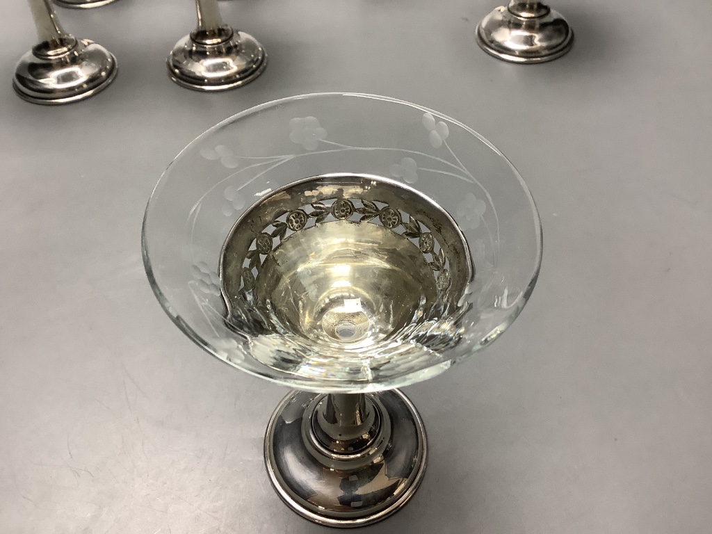 A set of eight Birks sterling mounted glass coupes, height 10.7 cm and a silver mounted two handle glass vase, height 11.9 cm.